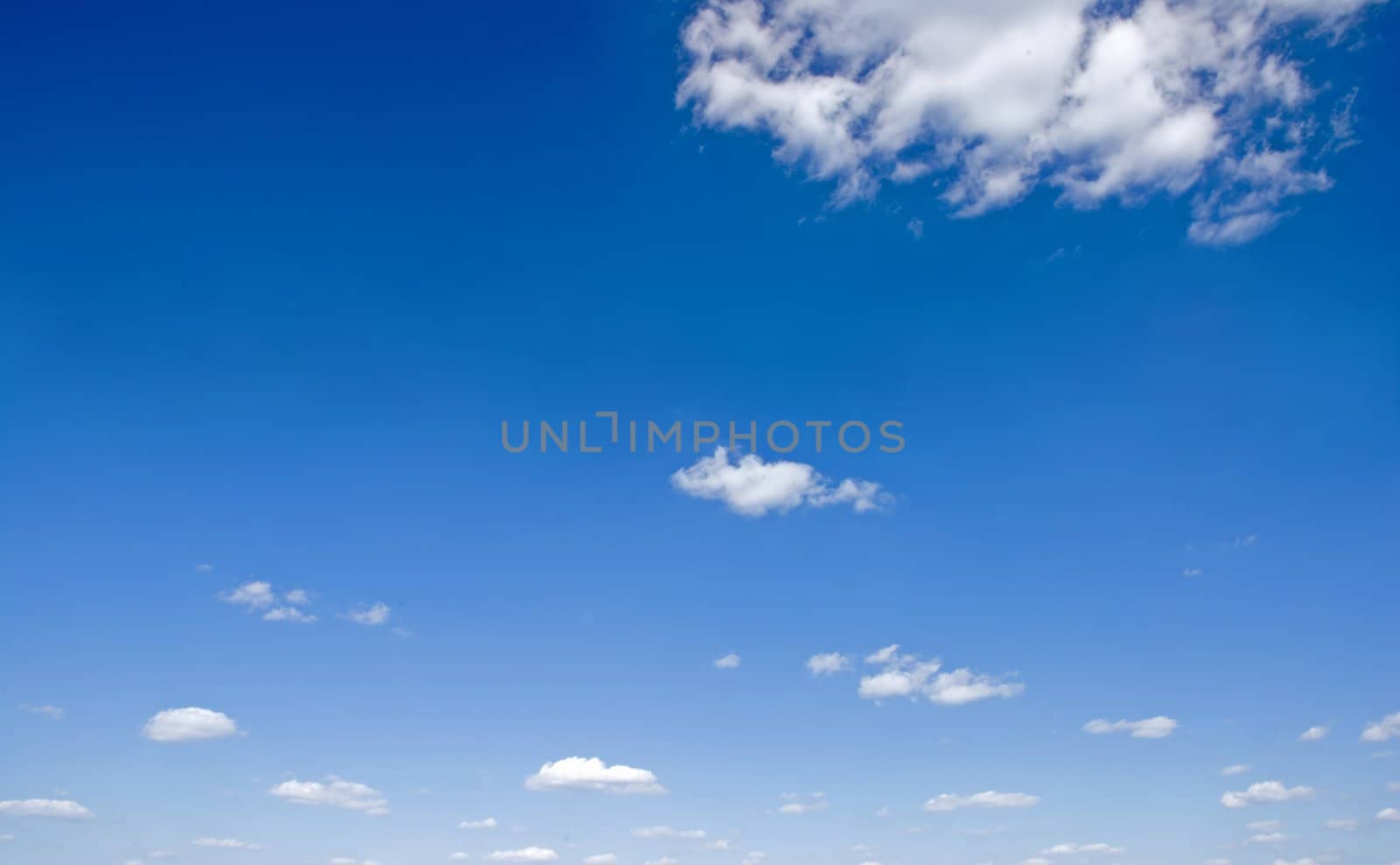 Blue sky with small clouds by fyletto