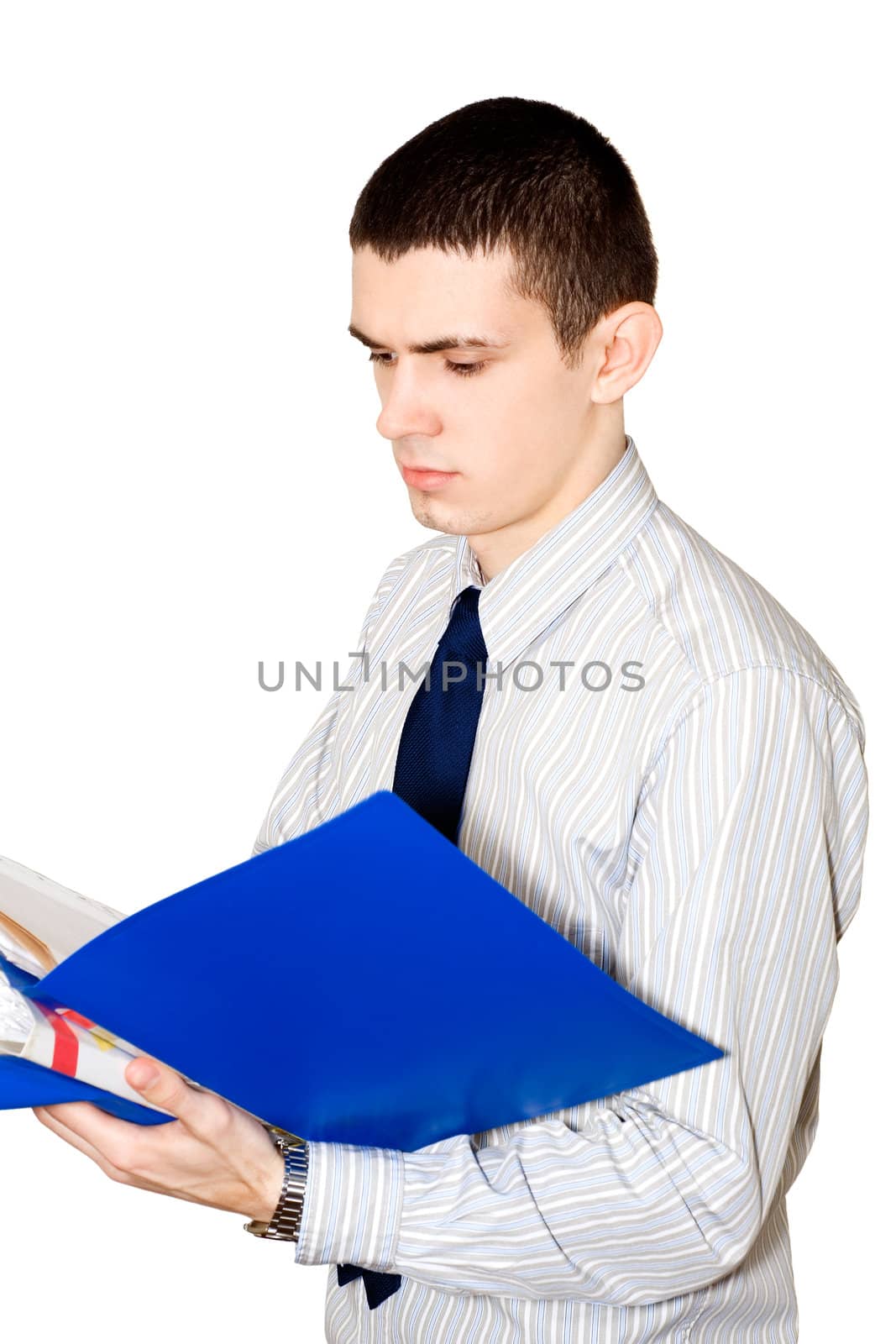 The young man in a striped shirt reads documents in a  blue folder
