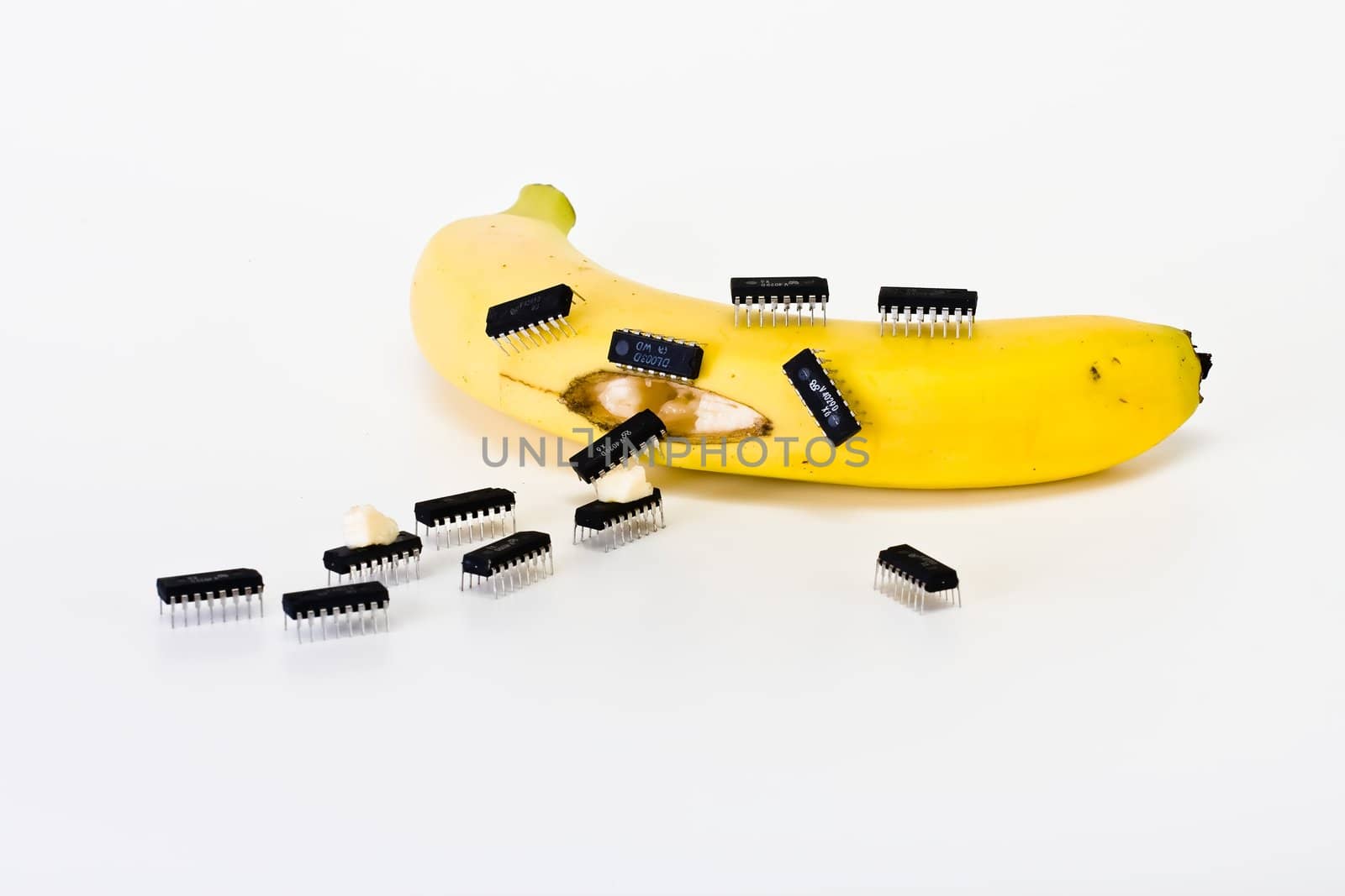 Computer chips crawling around banana