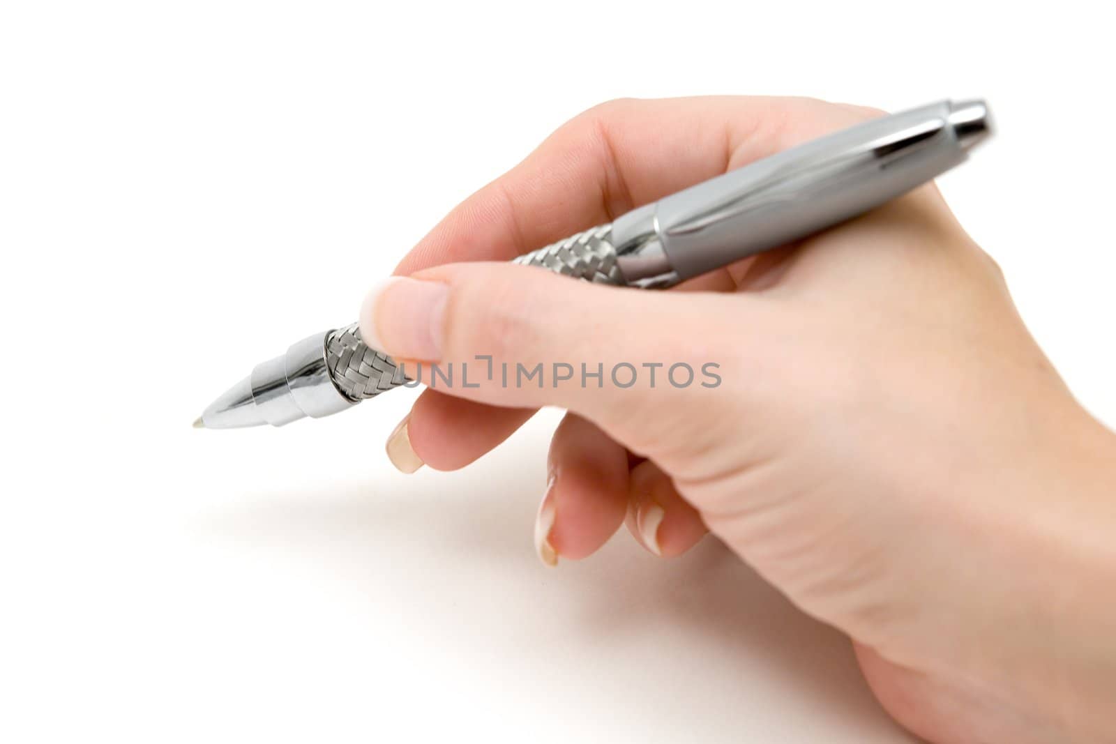 Woman holding a ball pen. Shallow depth of field. White background.