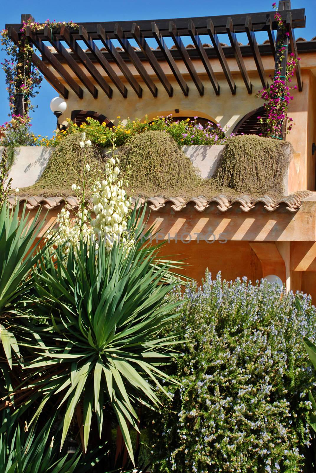 Balcony in the beautiful tropical blooming garden