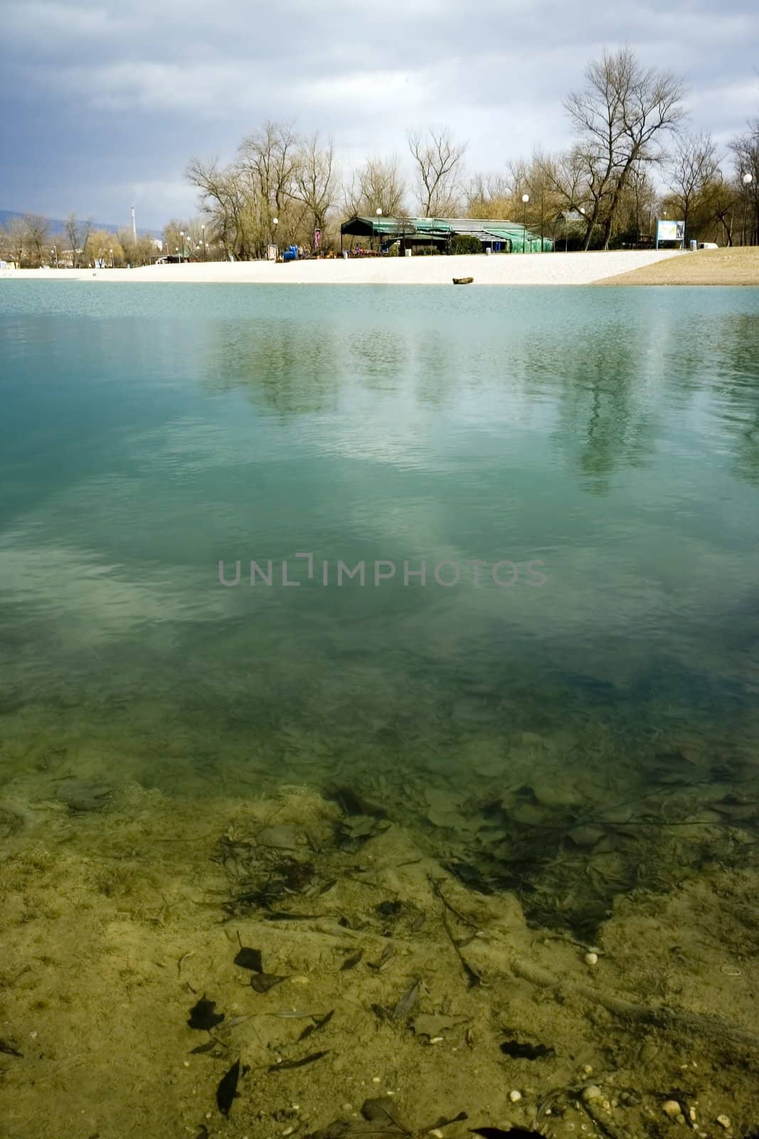 Turquise lake with  coastline and trees