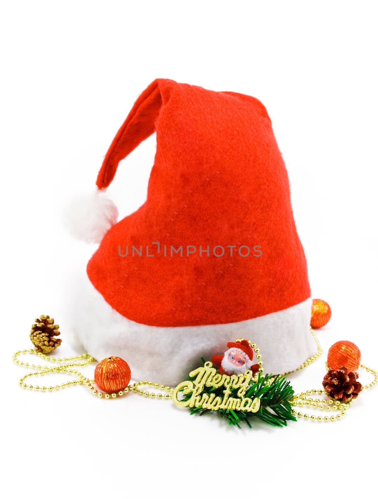 Red christmas Santa hat with gift and toys on white
