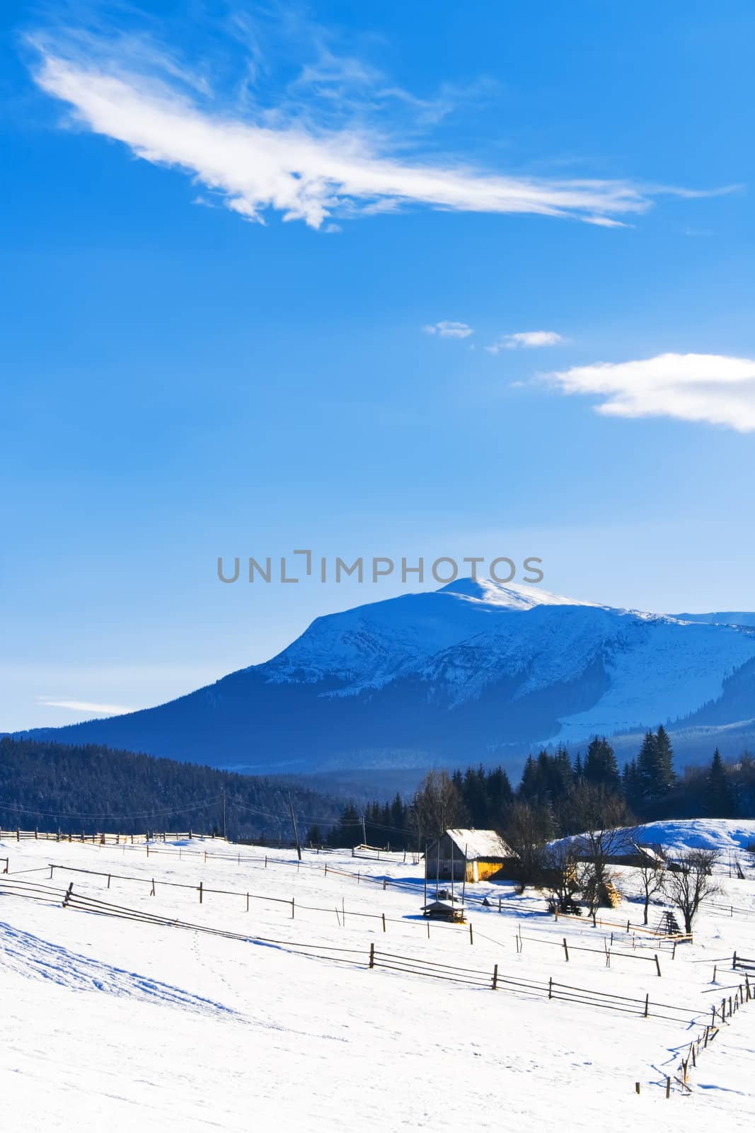 Lonely wooden house in snow covered mountains by lmeleca