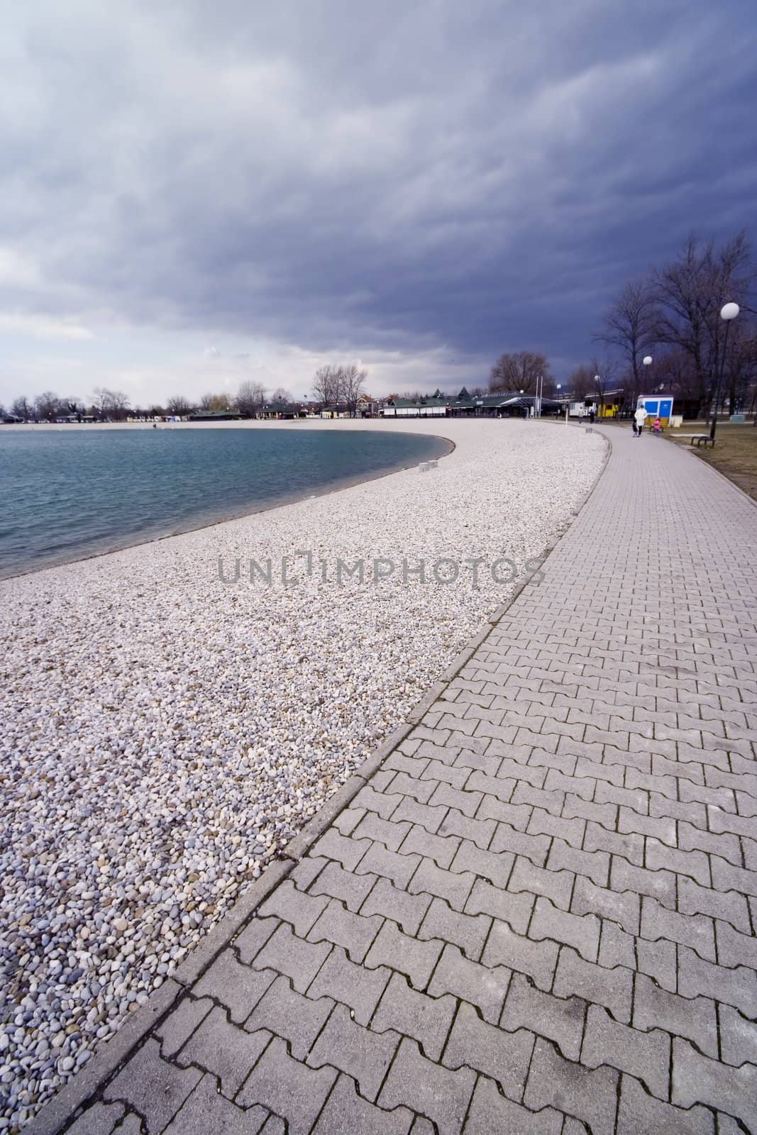 Path around the lake with clouds