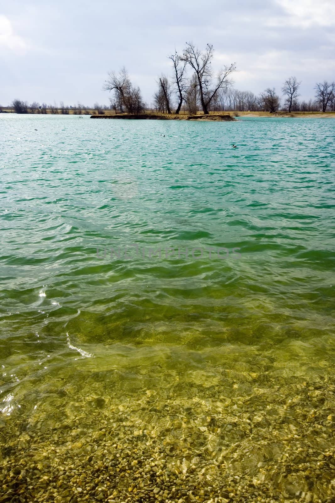 Turquise lake with island in background