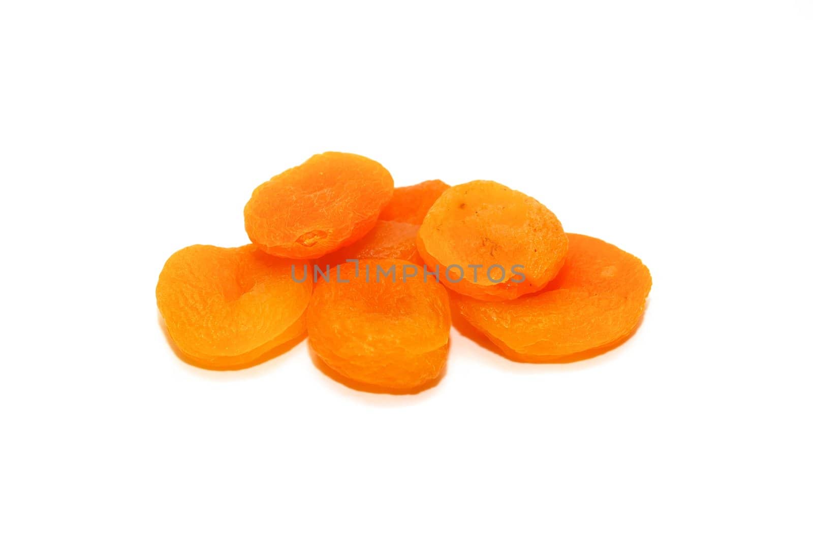 photo of the dried apricots on white background