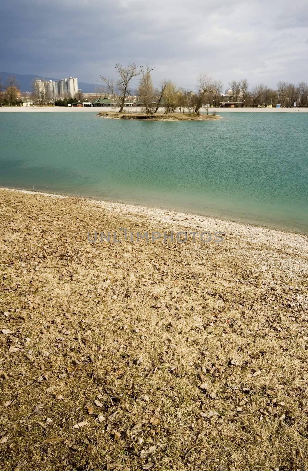 Turquise lake with island and coastline