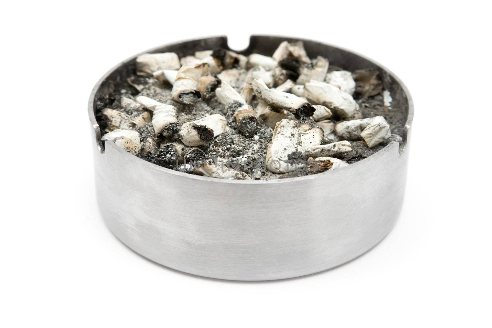 Overfilled ashtray isolated on a white background.