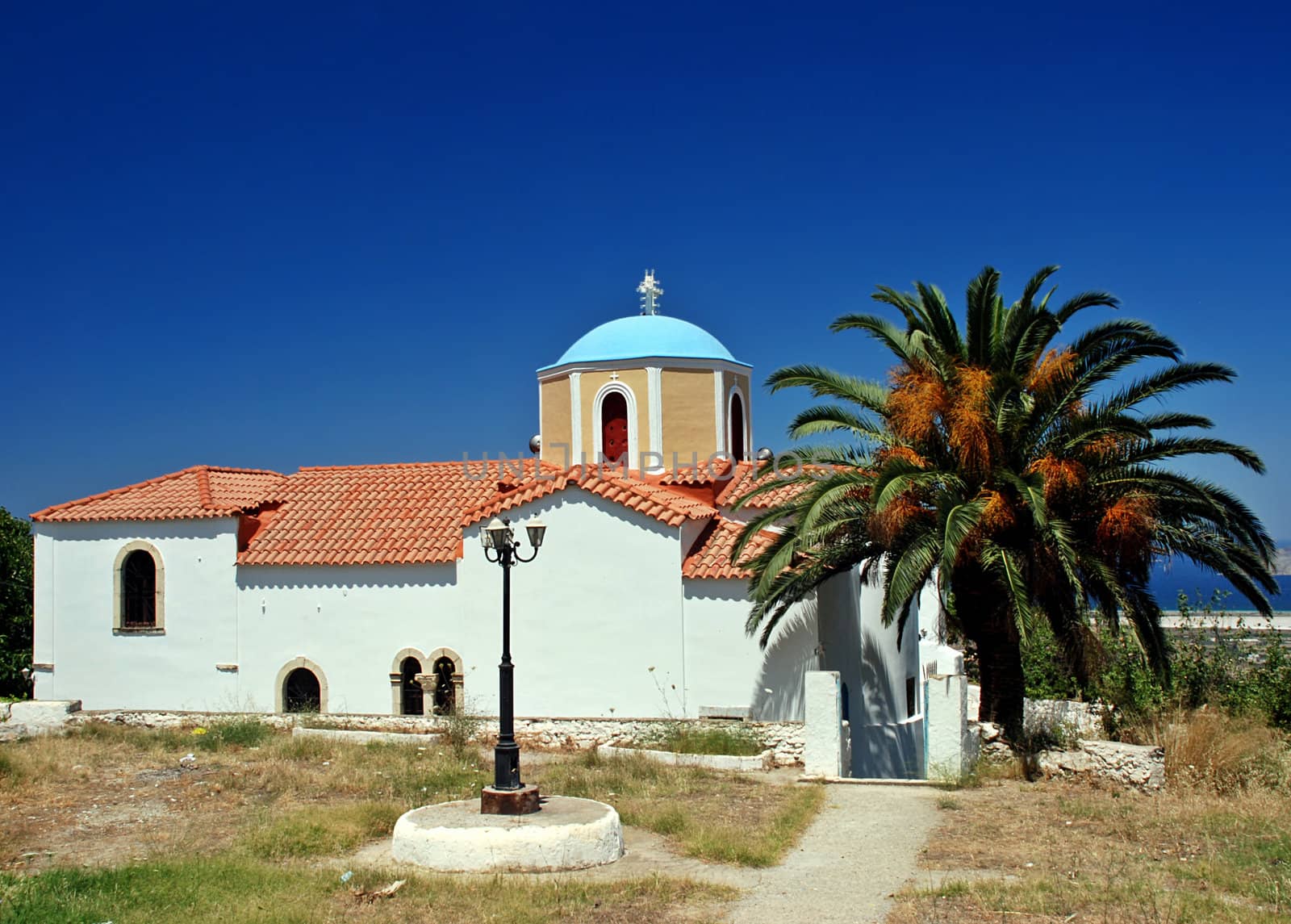 Greek orthodox church, lantern and palm