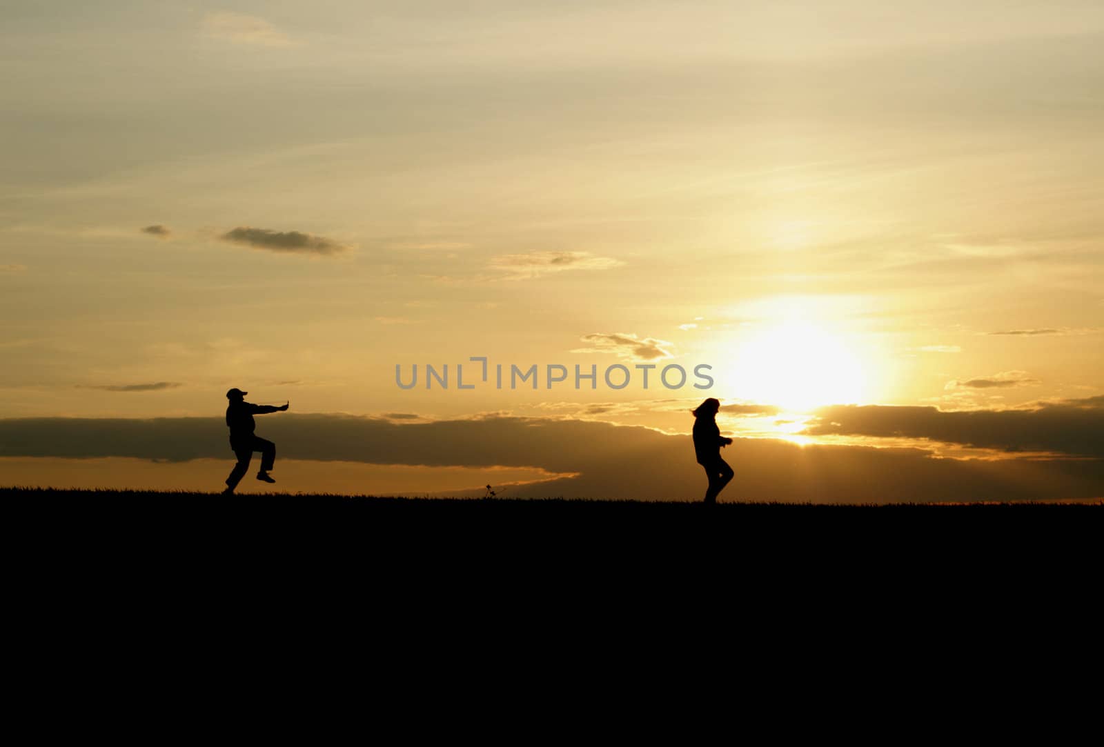 Running children on a sunset