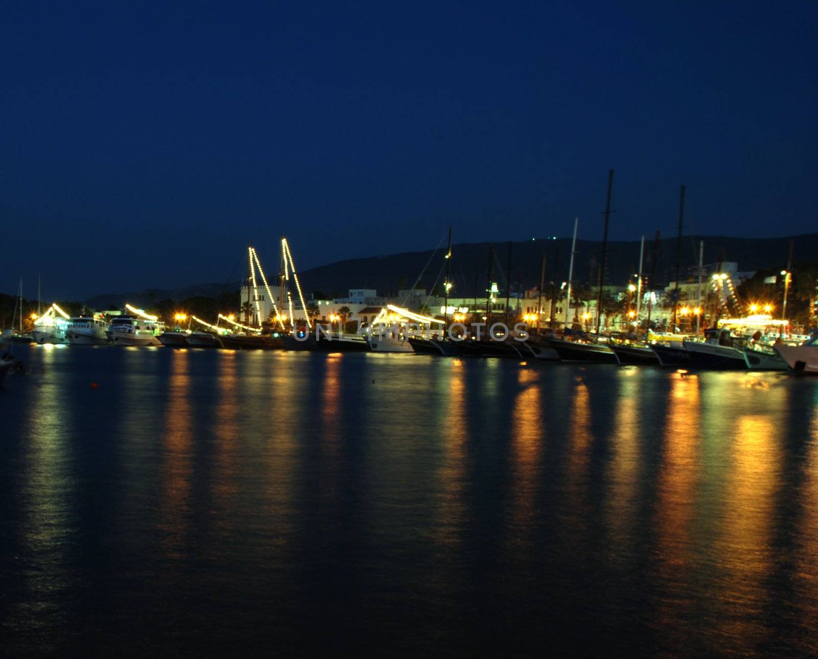 Harbor with ships at night