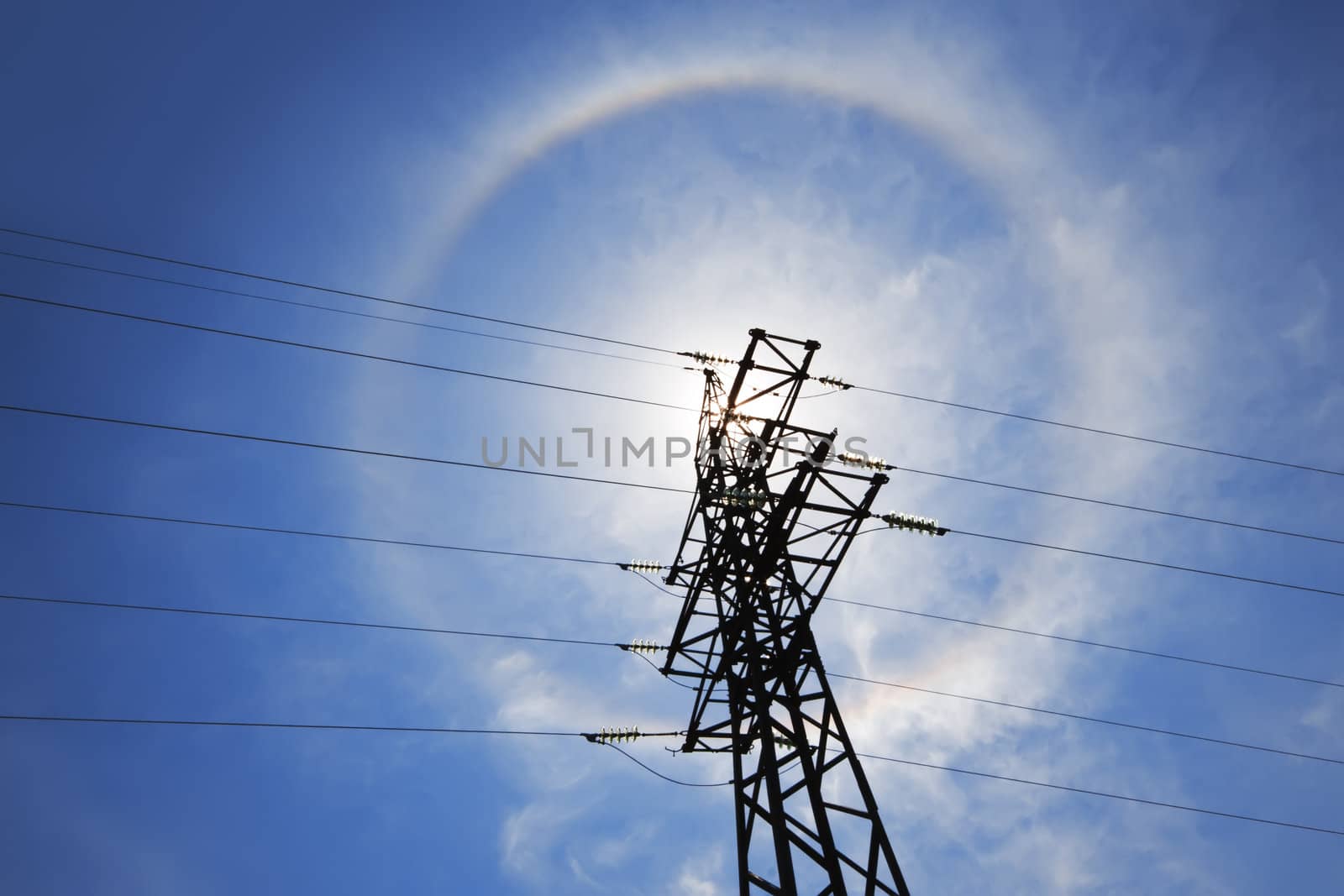 Amazing sun halo above high-voltage power supply network