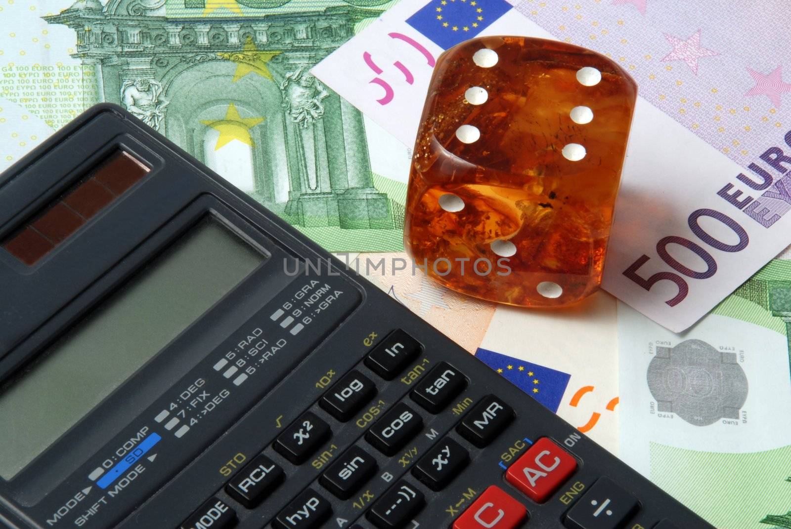 Hazard of business - calculator with dice on money background