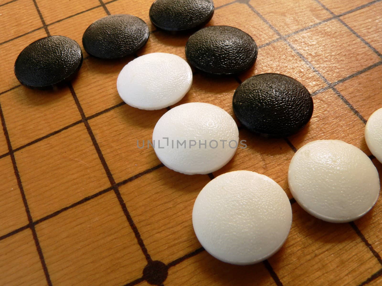 Black and white stones on the go-board.