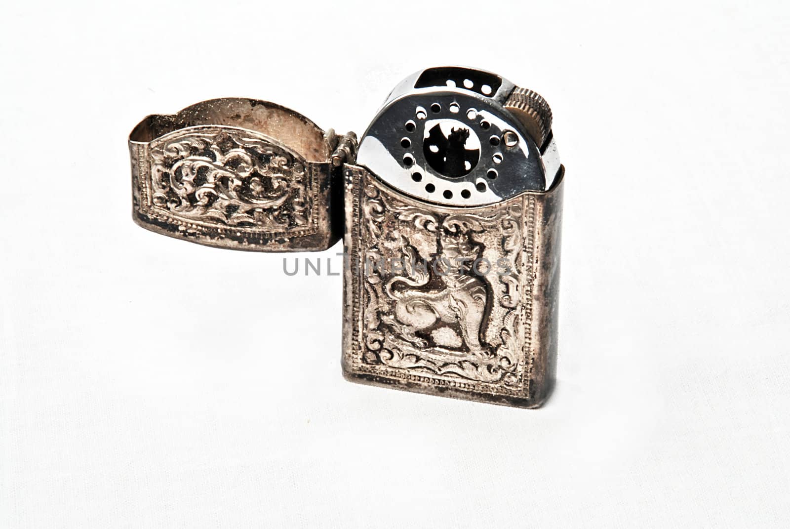 Ancient silver lighter with dragon engraving
