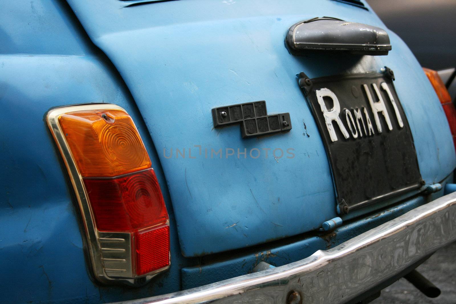 blue car depicting typical Rome, Italy