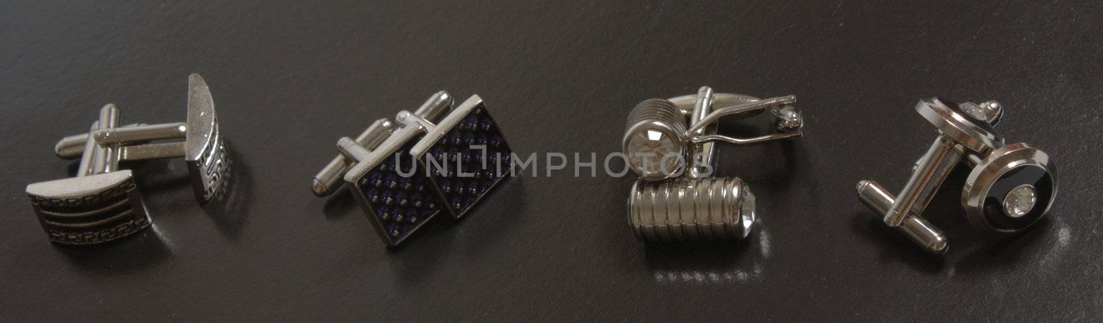 stainless steel cufflinks on the black background