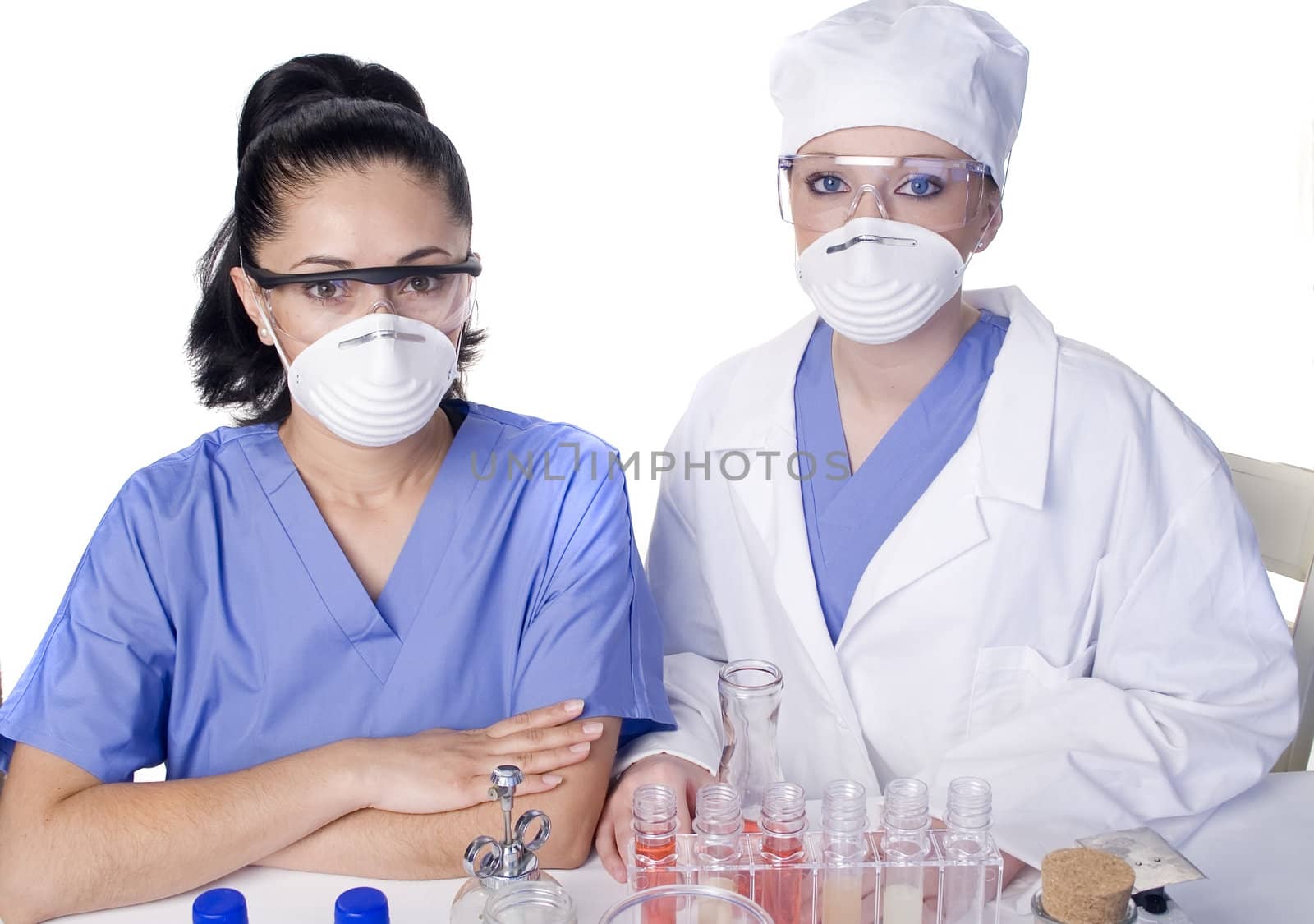Young scientist in laboratory with test tubes and chemicals
