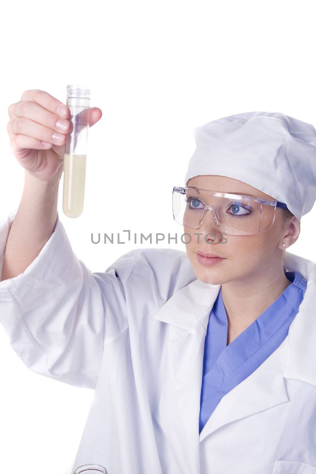 Young scientist in laboratory with test tubes and chemicals