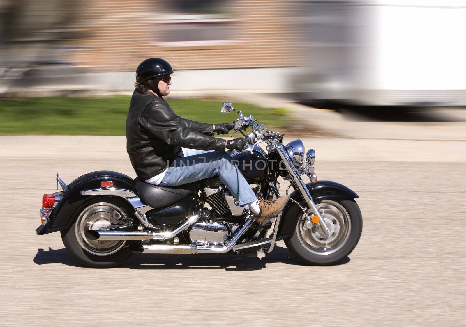 Man enjoying a motorcycle ride in the city (motion blur)