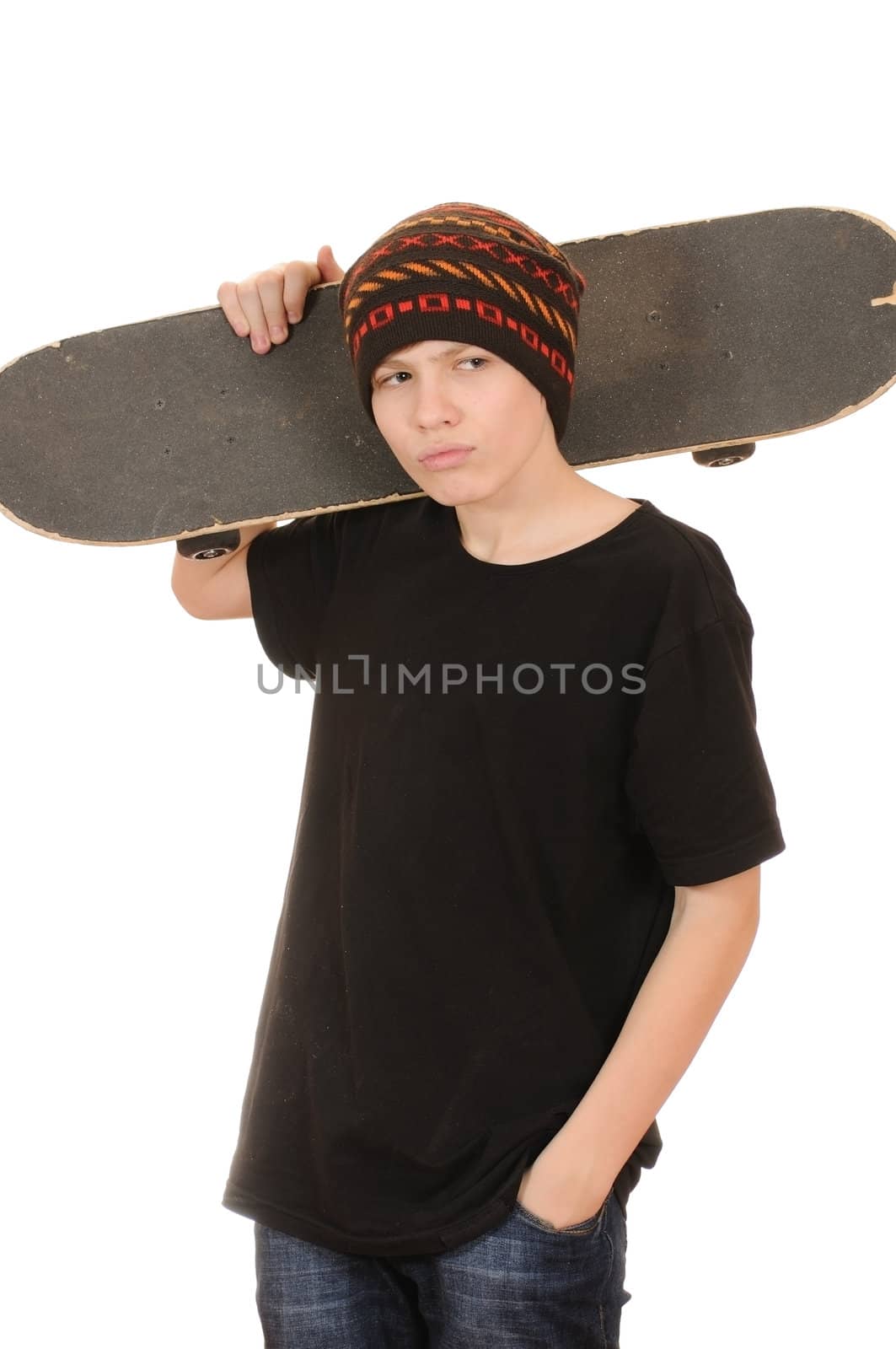 The teenager with a skateboard and in a hat isolated on white background