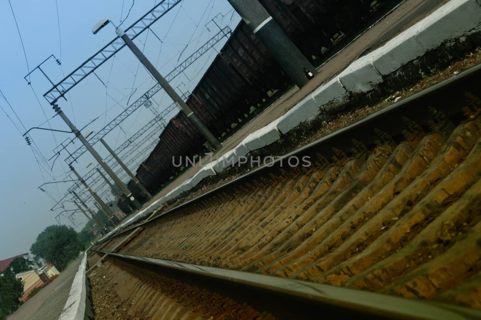 Railway station under an inclination with a freight train