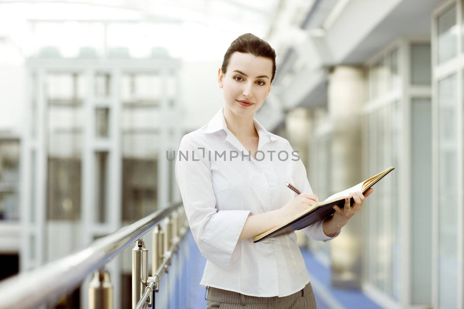 Portrait of young woman with calendar 