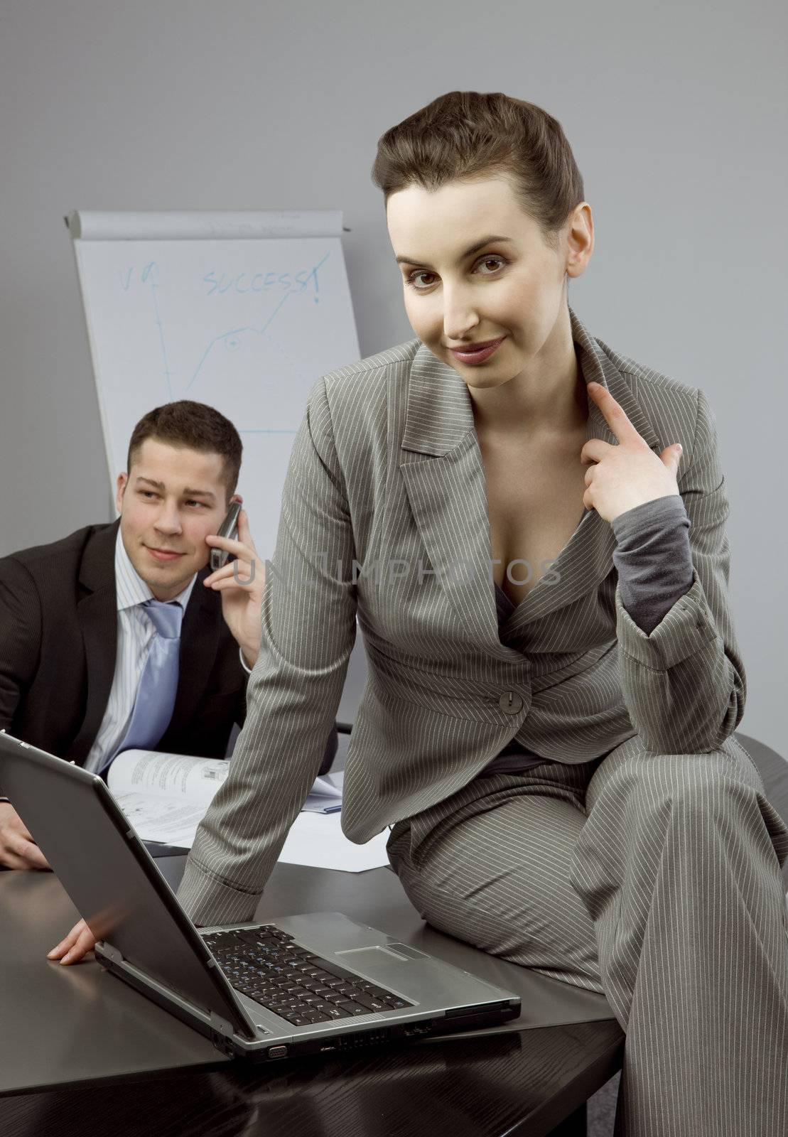 Business couple portrait - young man and woman on business meeting