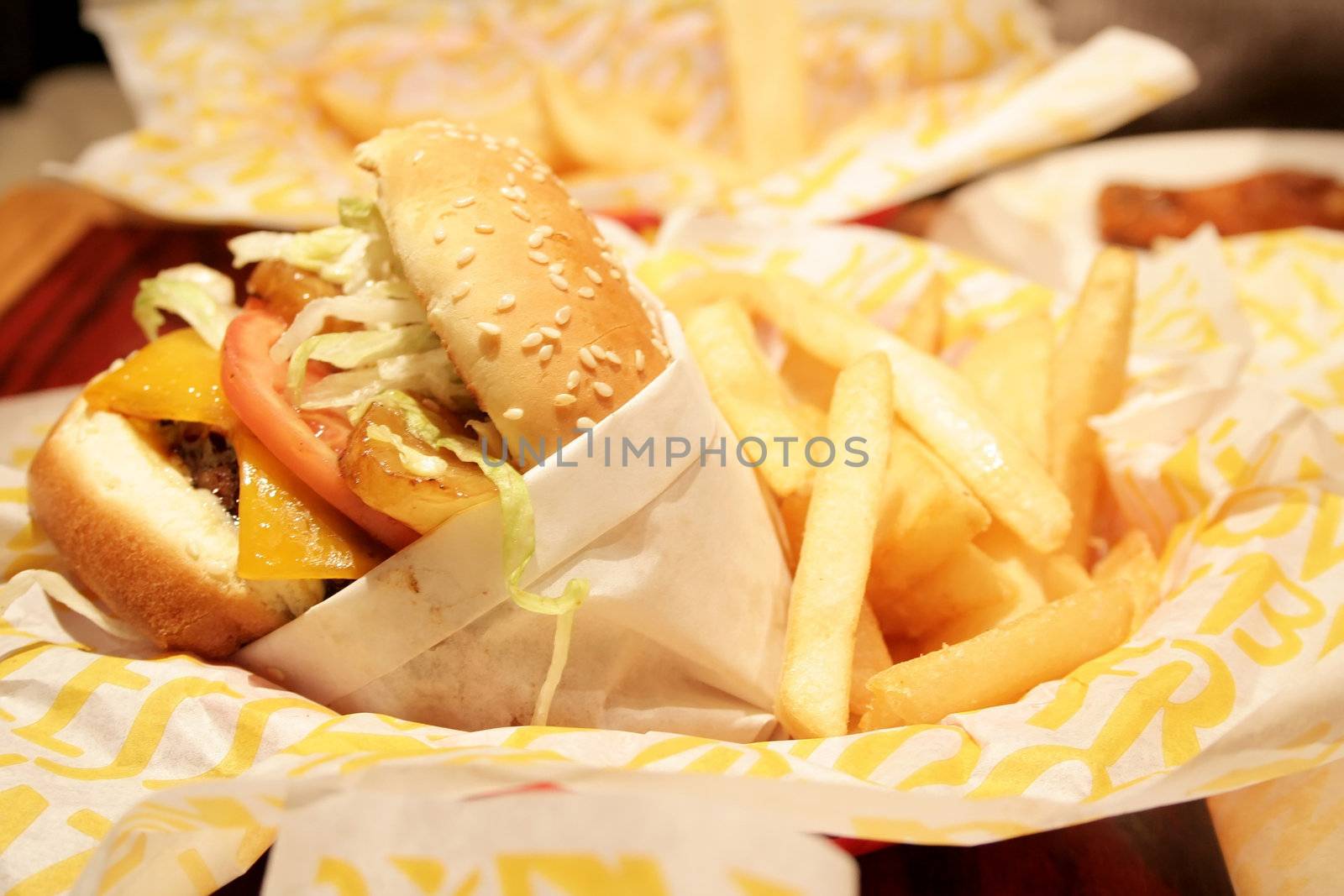 Hamburger and french fries in a basket