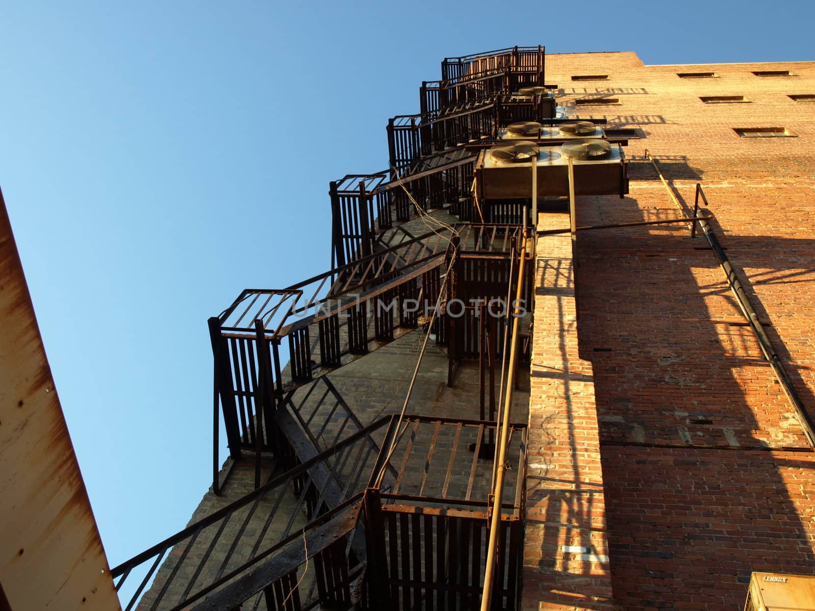 Up the back fire escape of an old building