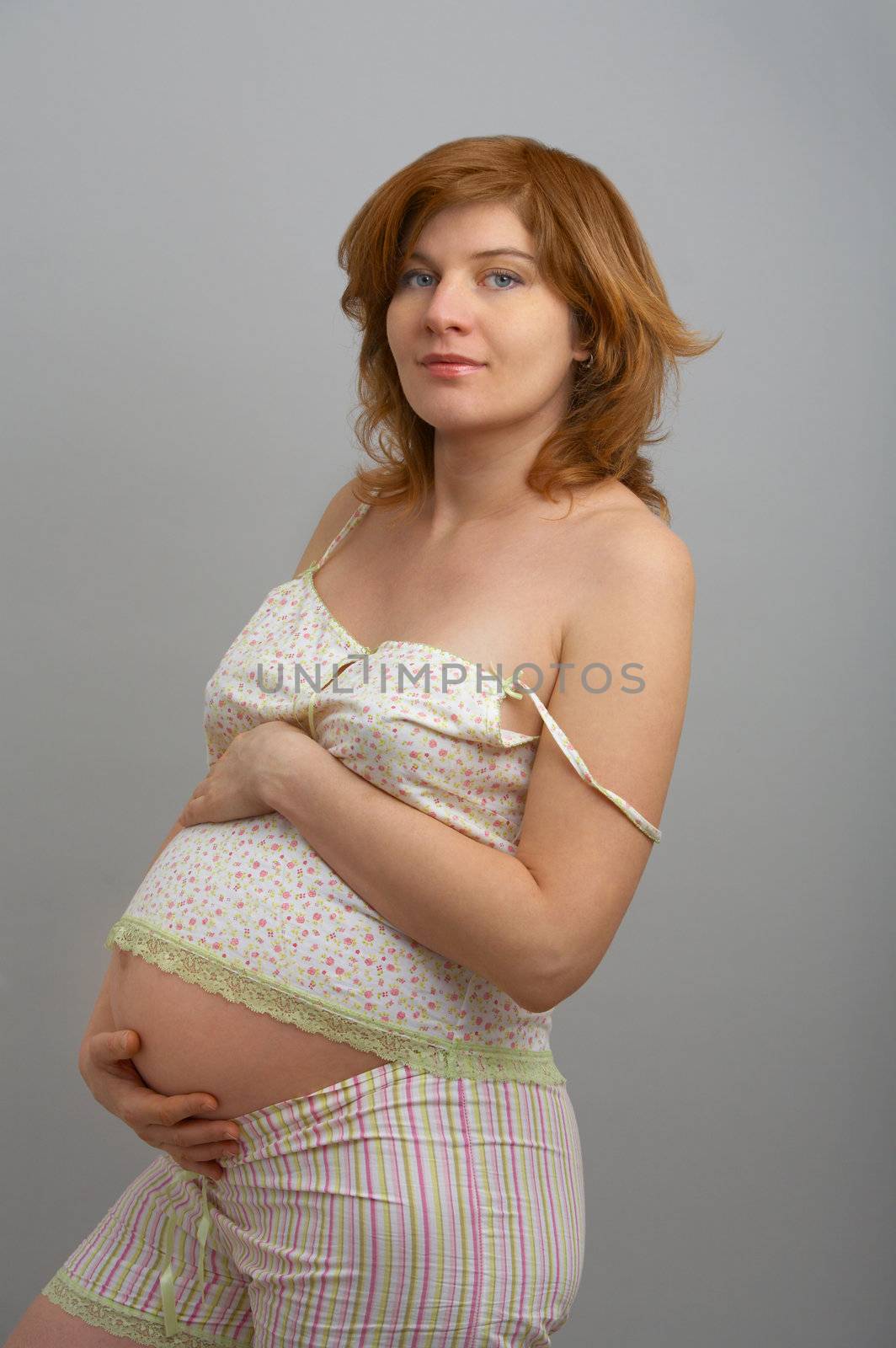 expectant mother with a pleased smile upon one's face