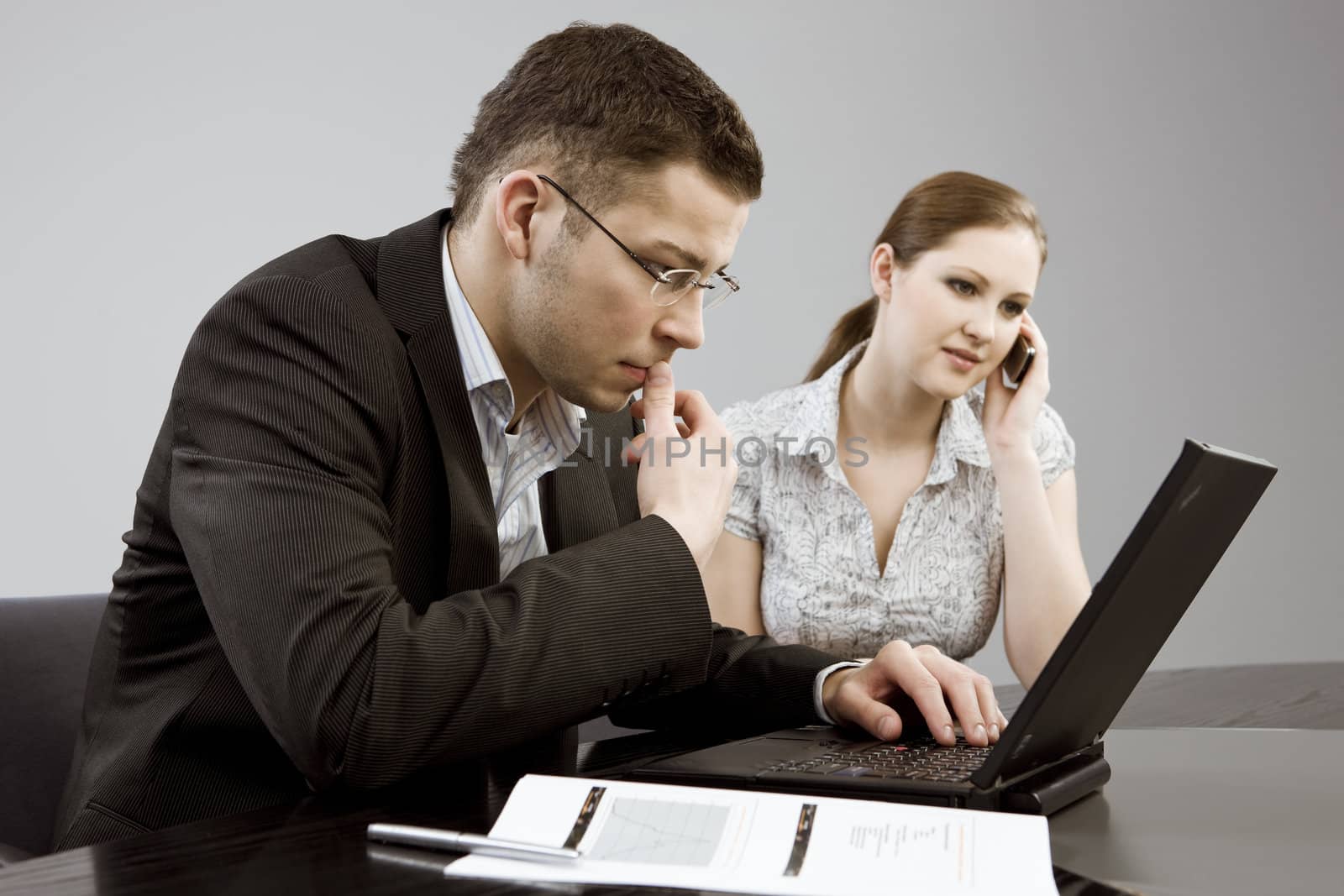 Business couple portrait - young man and woman working together