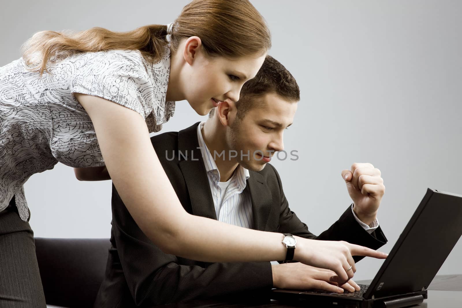 Business couple portrait - young man and woman working together