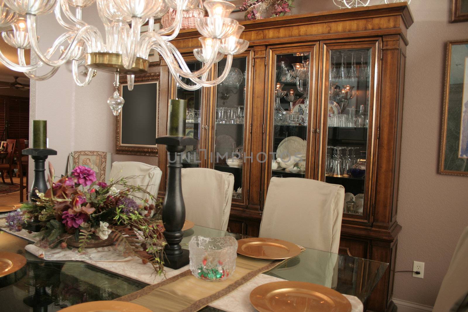 Fancy dining room with cabinet full of crystal