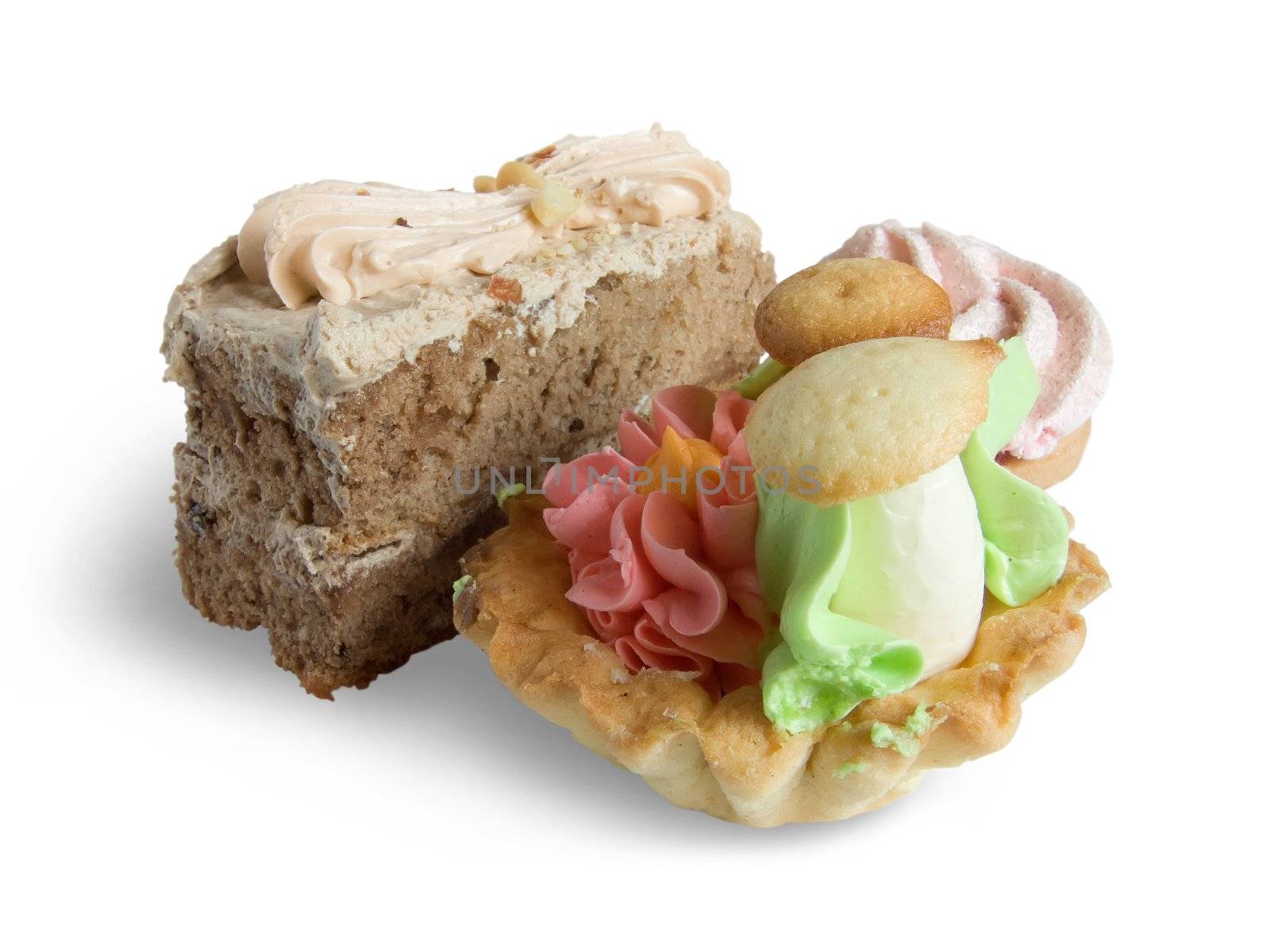 Biscuit cakes with an oil cream on white. Isolated