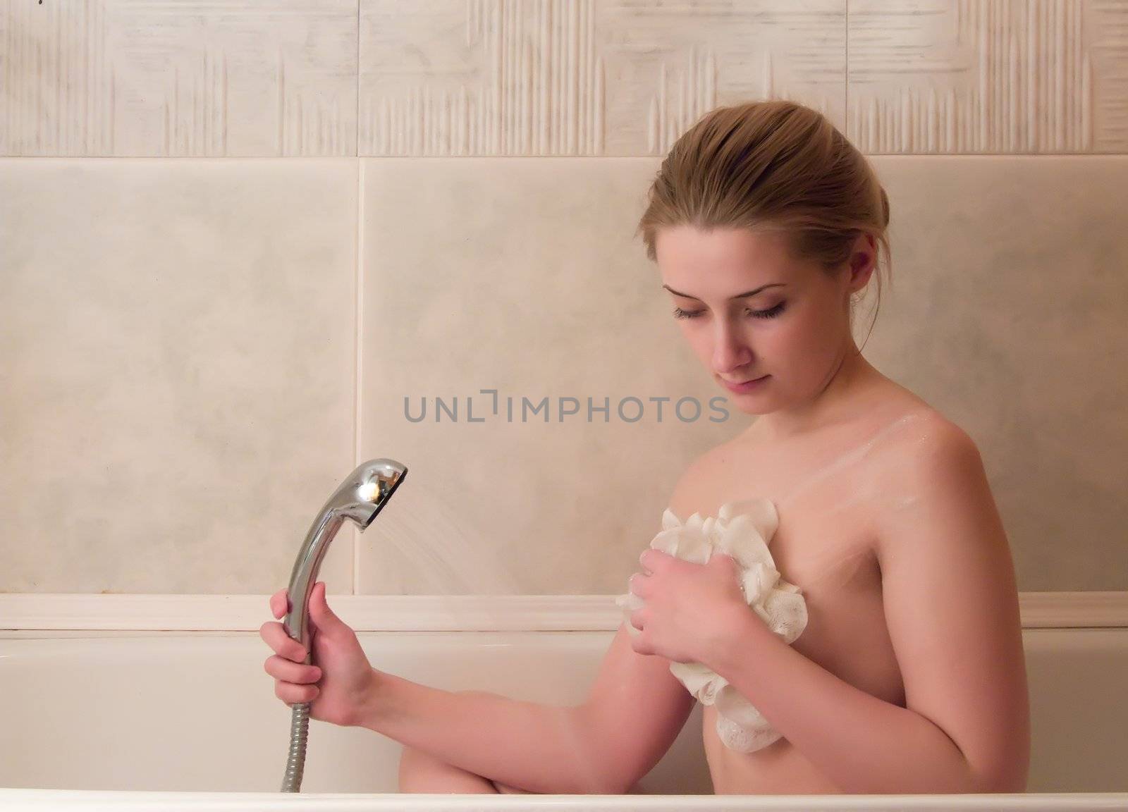 young beautiful girl in a bathroom