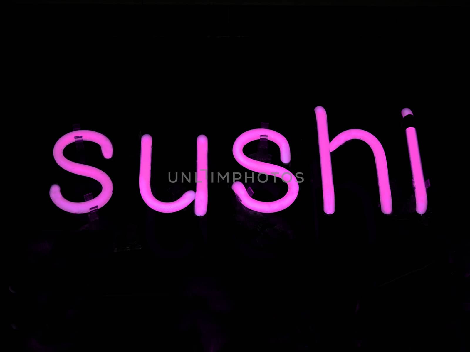 Neon SUSHI sign in a restaurant window