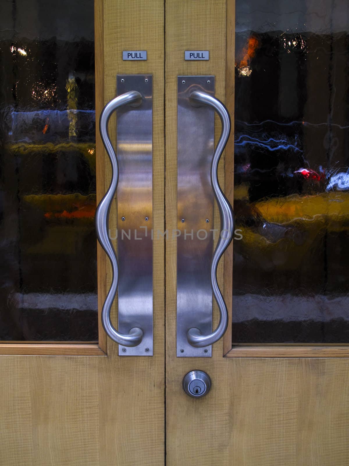 Silver door handles on wood door by ADavis