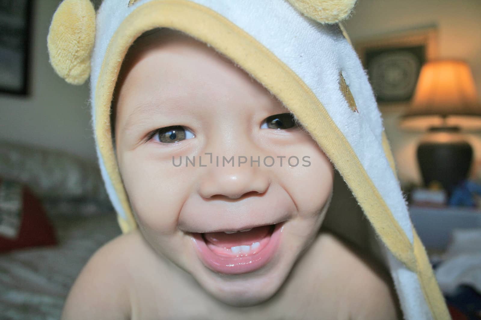 young baby boy with bath towel
