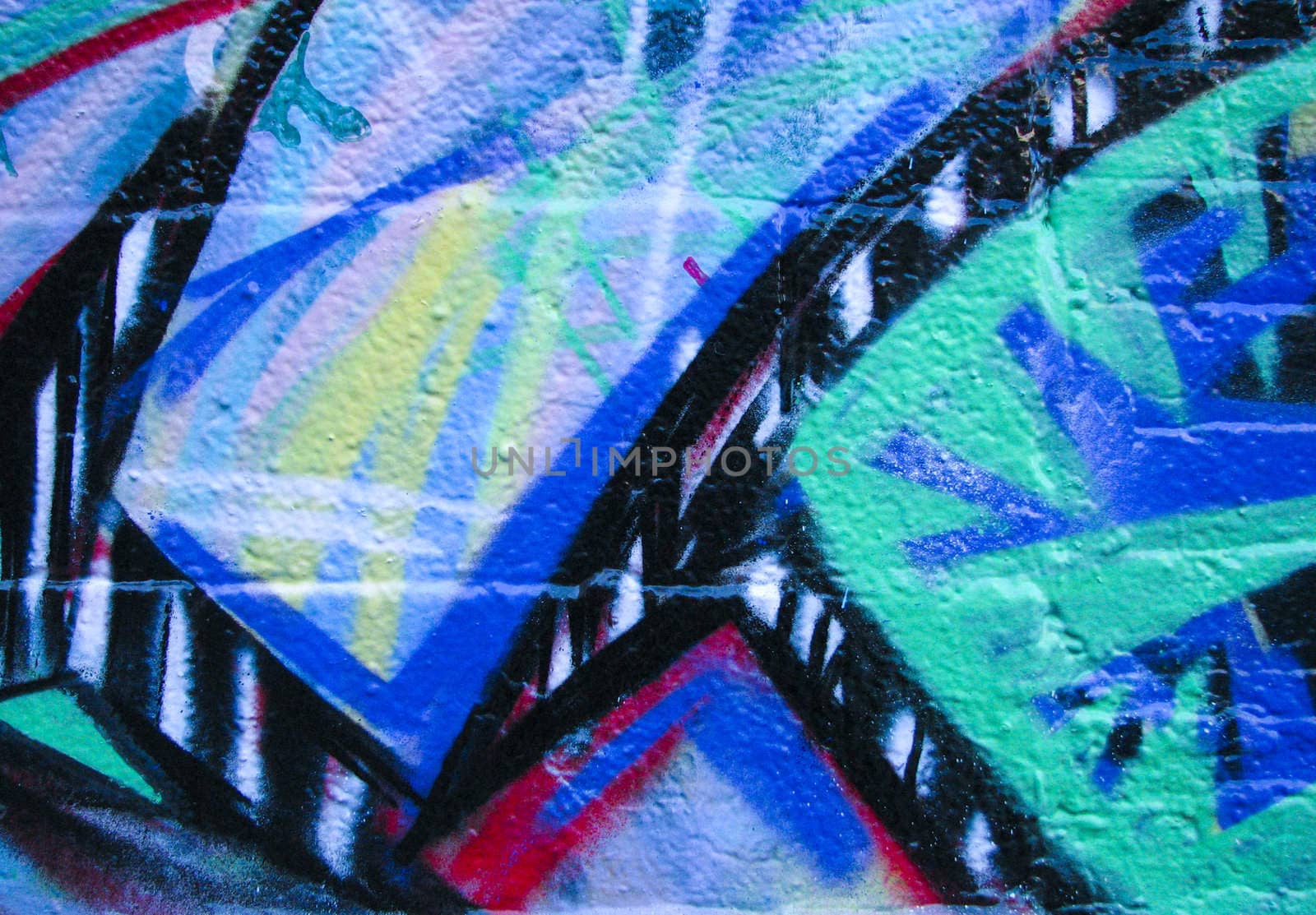 Multi color graffiti background on brick
