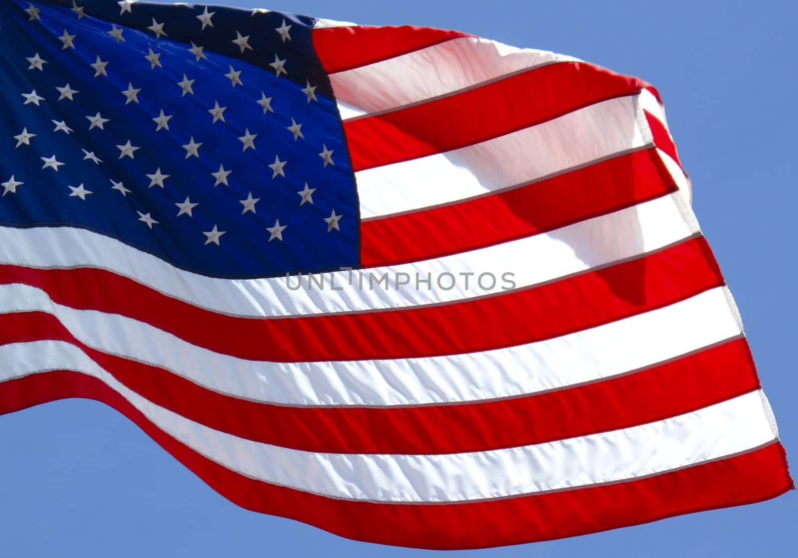 Vibrant American flag blowing in the wind