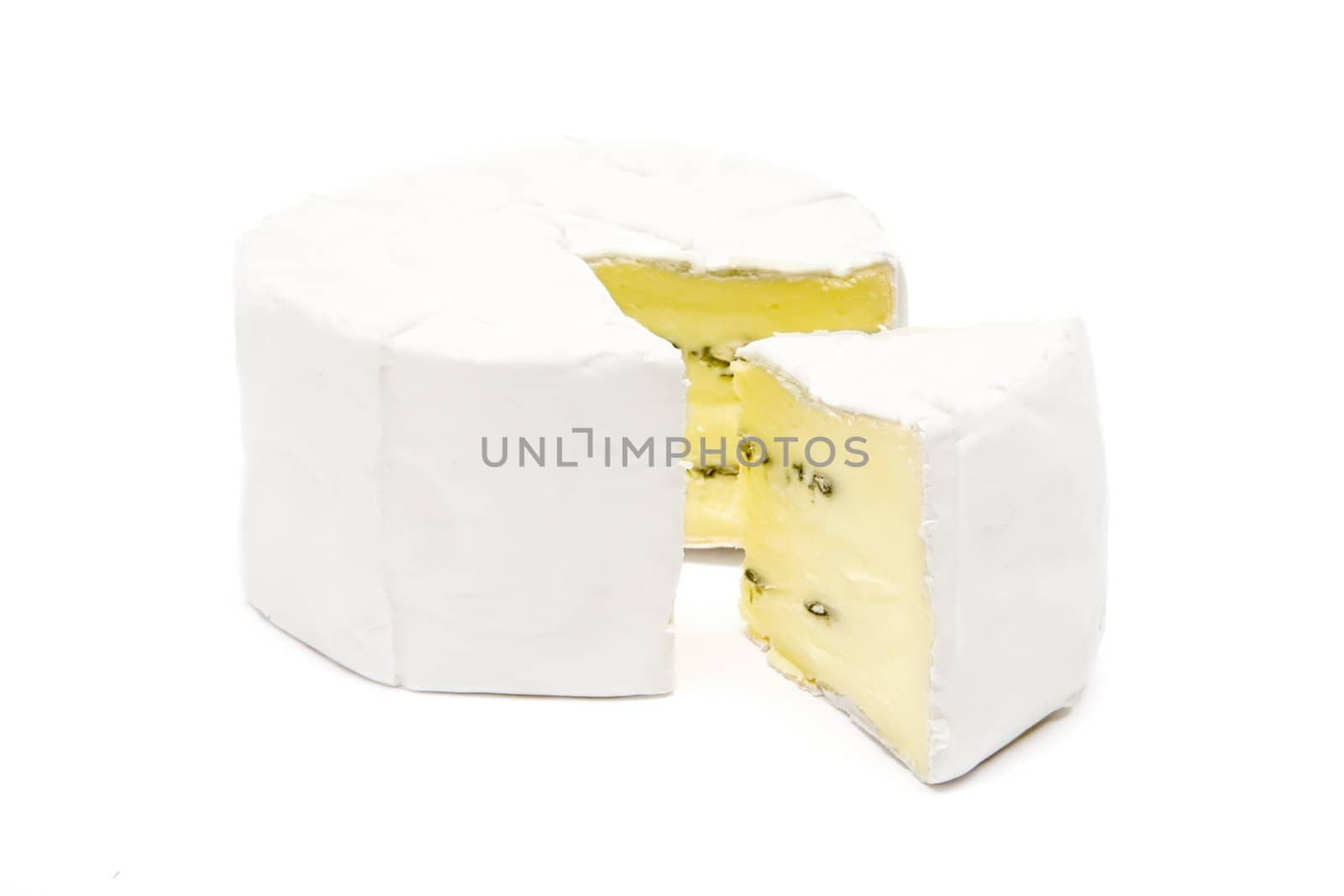Cut-out piece of French soft cheese isolated on a white background.