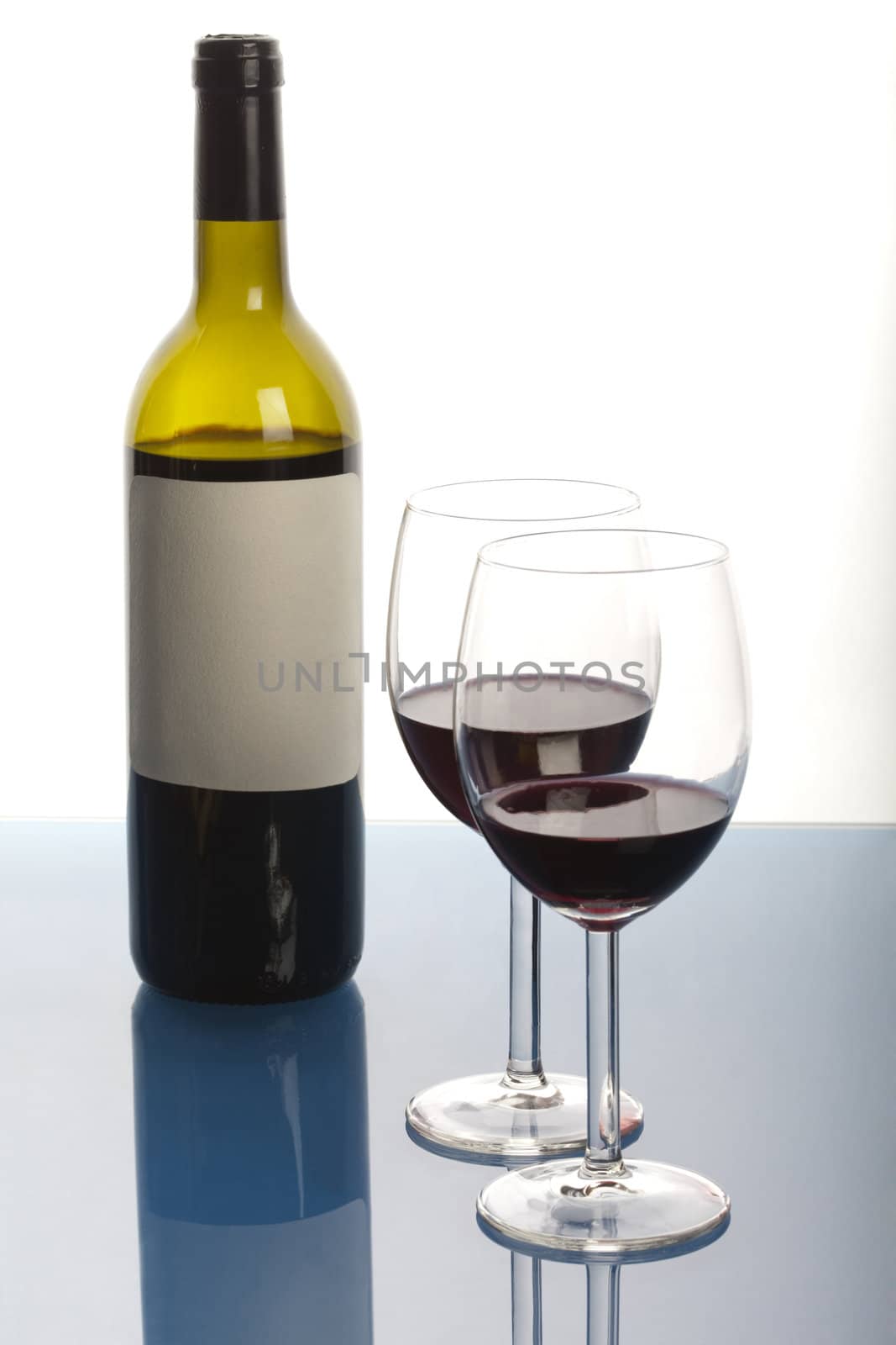 Alcohol - a bottle of wine on light background