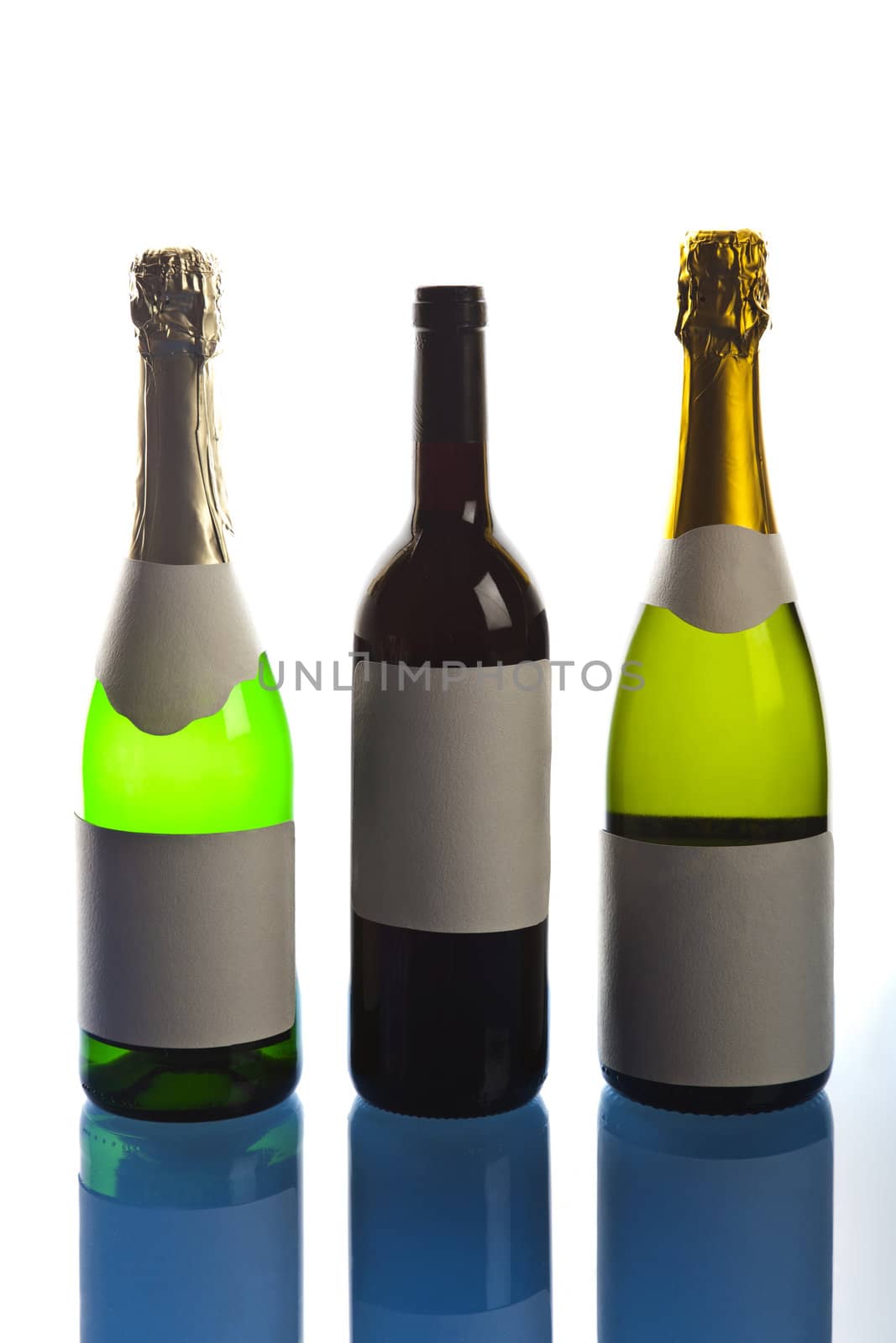 Beautiful big green bottles of chilled champagne on a delicate background