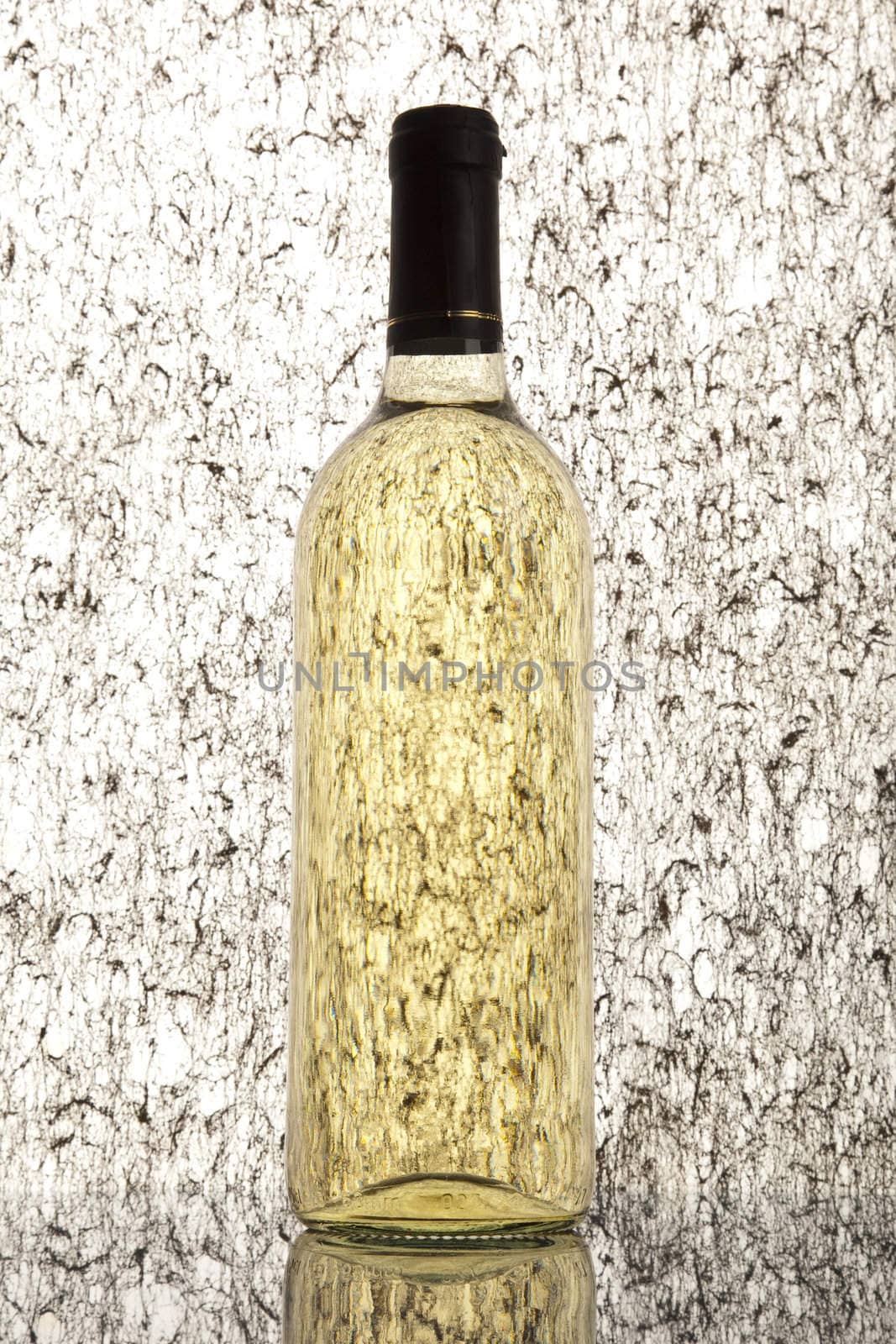 Alcohol - a bottle of wine on light background