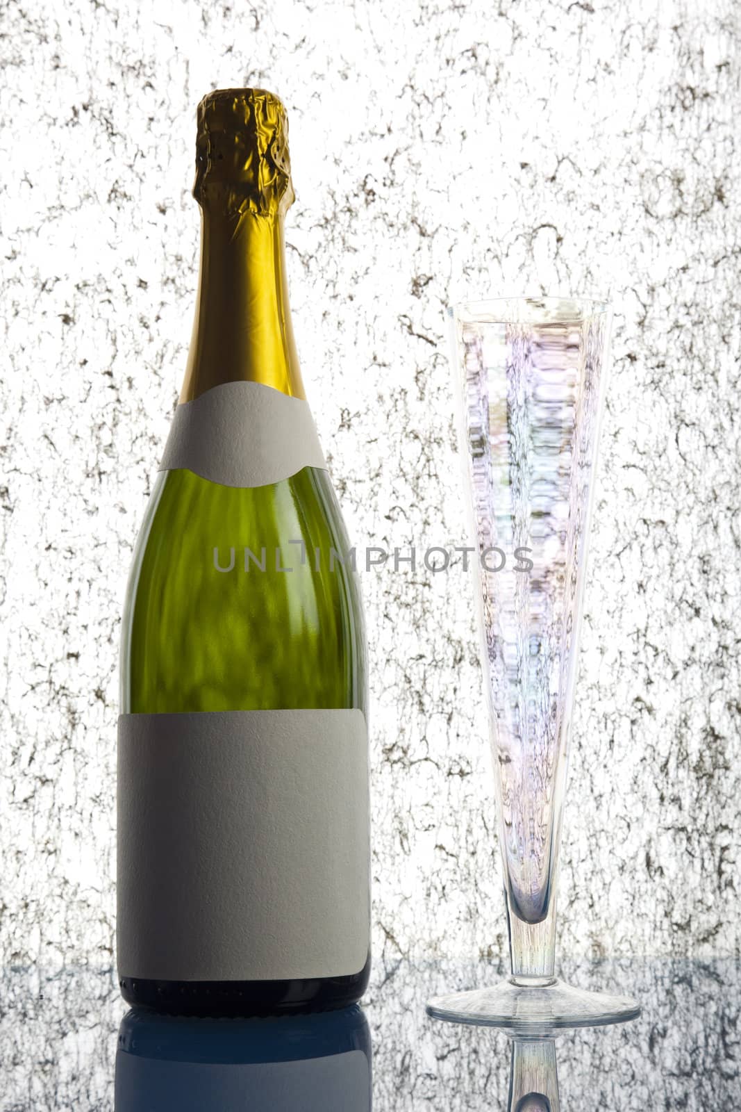 Beautiful big green bottle of chilled champagne on a delicate background