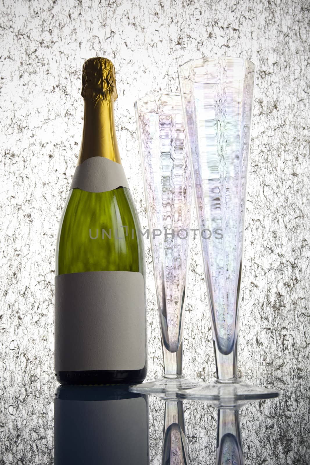 Beautiful big green bottle of chilled champagne on a delicate background