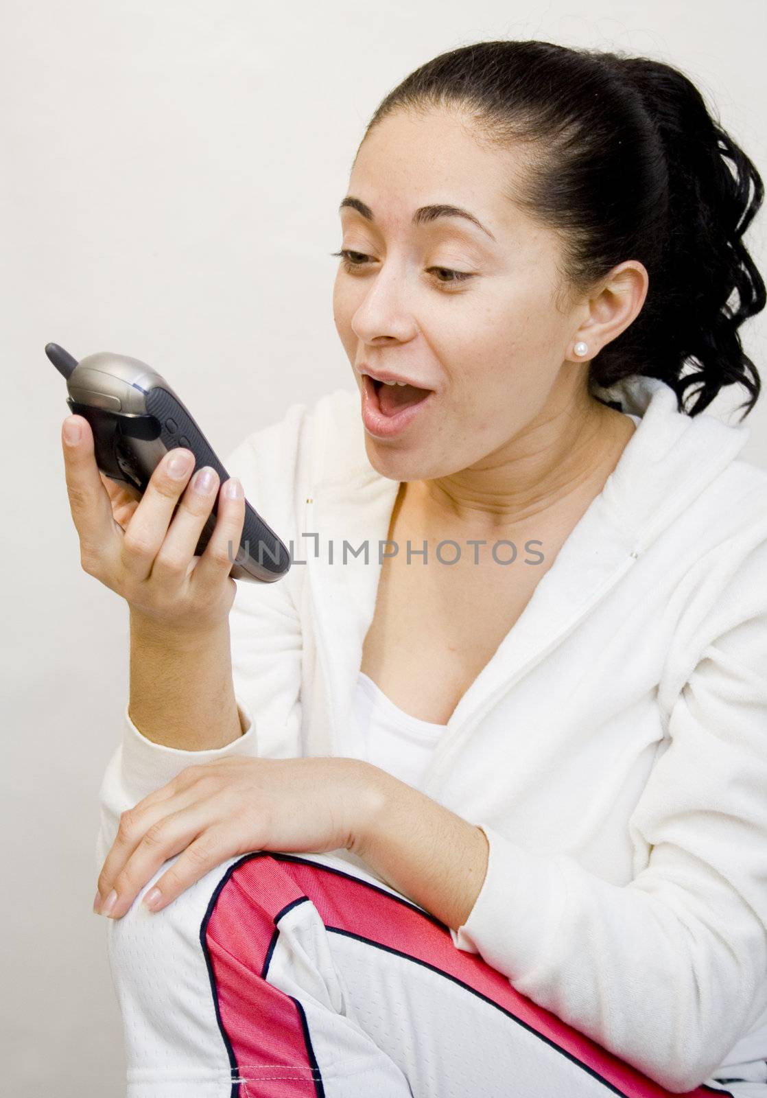 Young hispanic woman yelling at phone