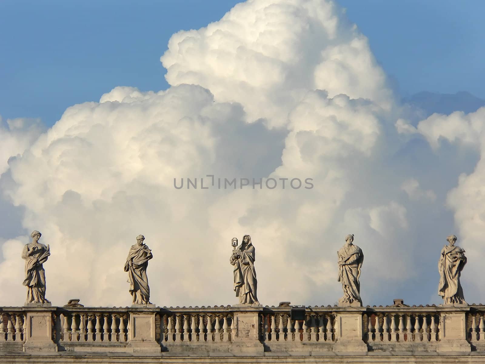 statues in s.pietro in rome whit clouds